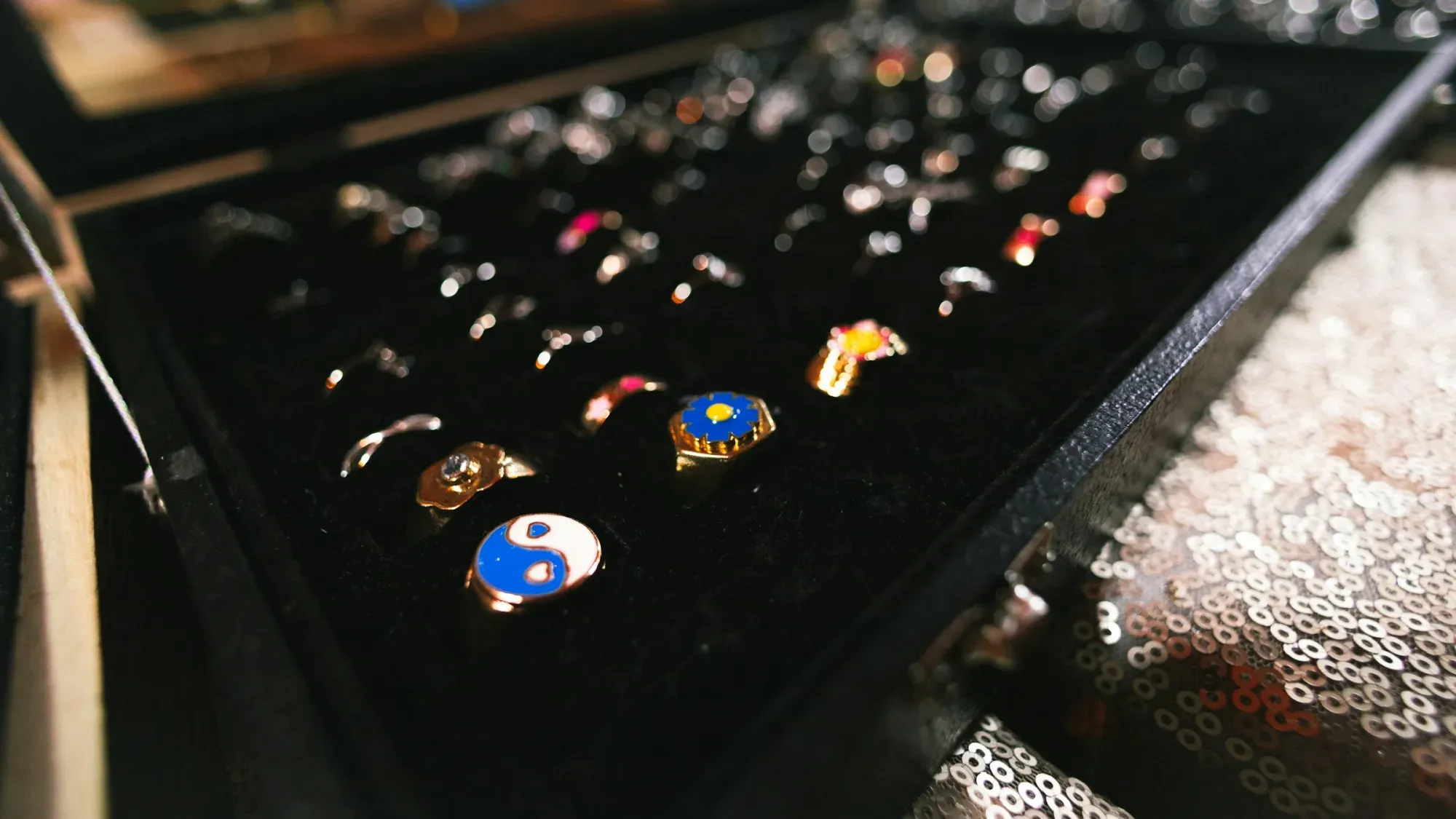 a group of colorful round objects on a black surface